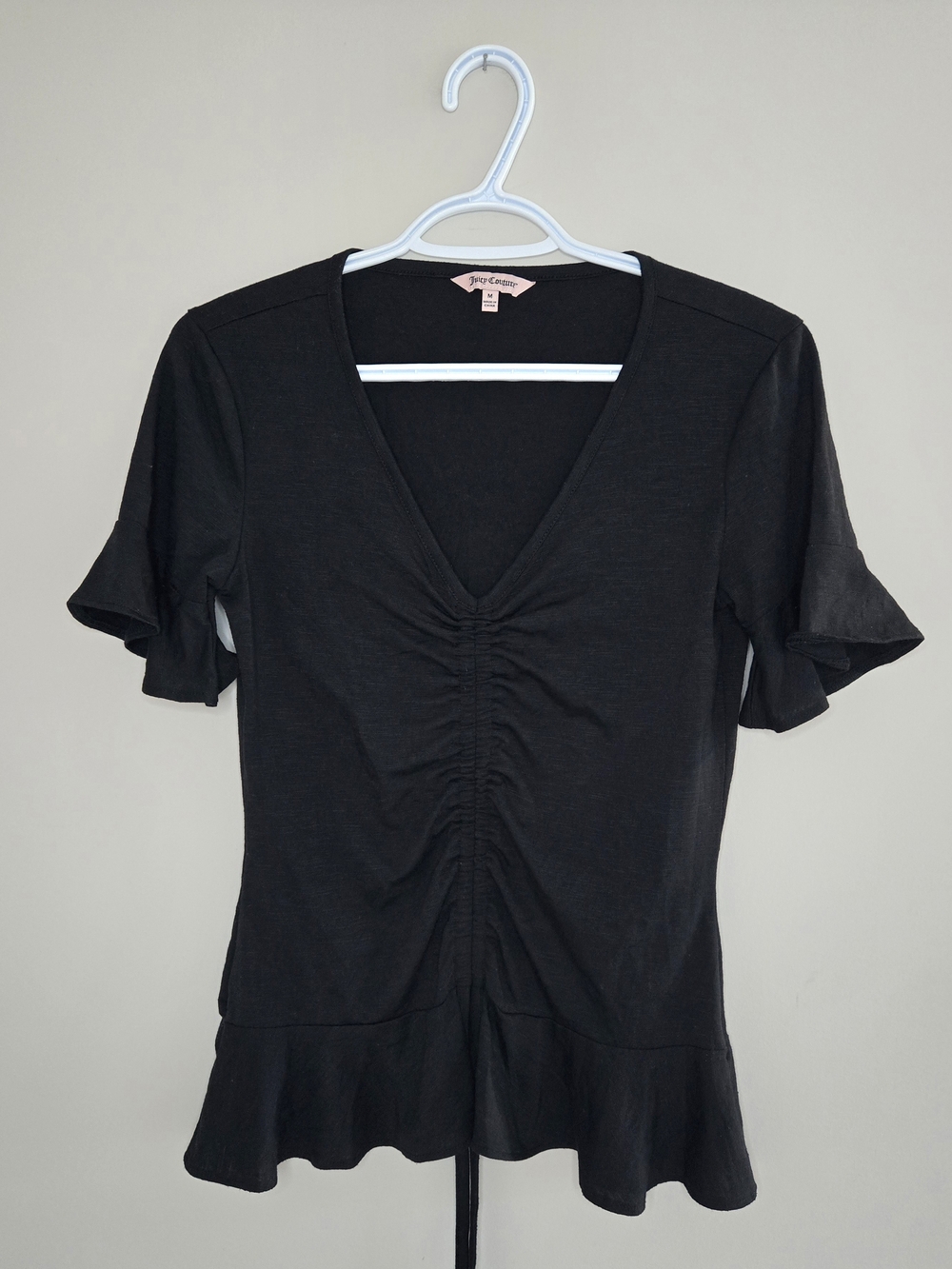 Juicy Couture black ruched v-neck top, adjustable drawstring, ruffle hem